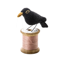 Load image into Gallery viewer, Blackbird on spool of thread
